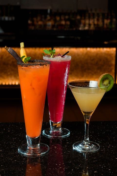 Trio of colorful specialty cocktails