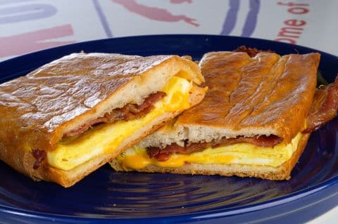Cuban breakfast sandwich with bacon, egg, and cheese