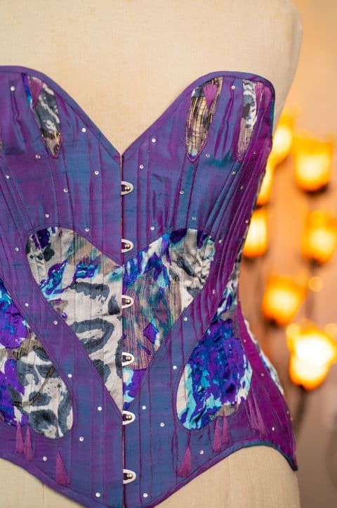 Detail of a hand-beaded silk corset bustier