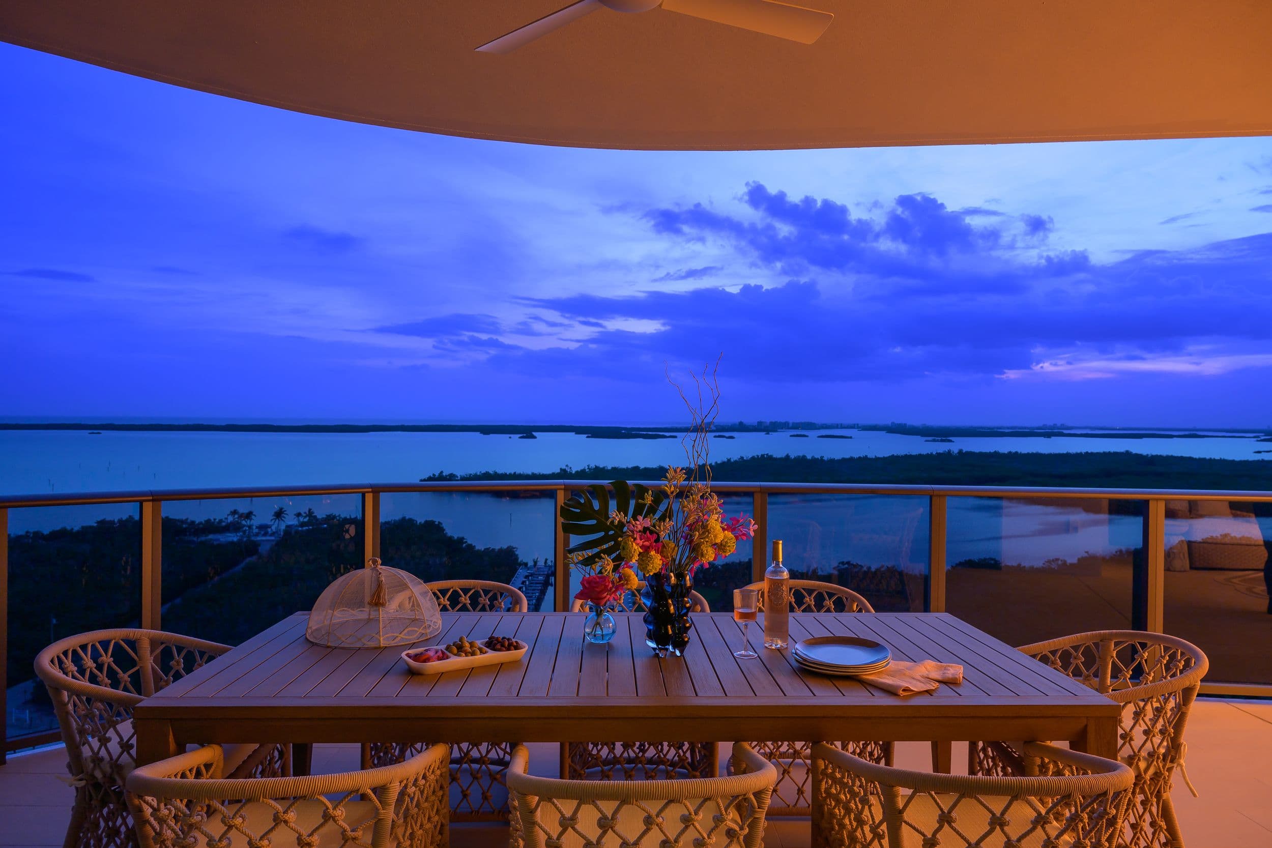 Table setting with view of Gulf of Mexico at sunset
