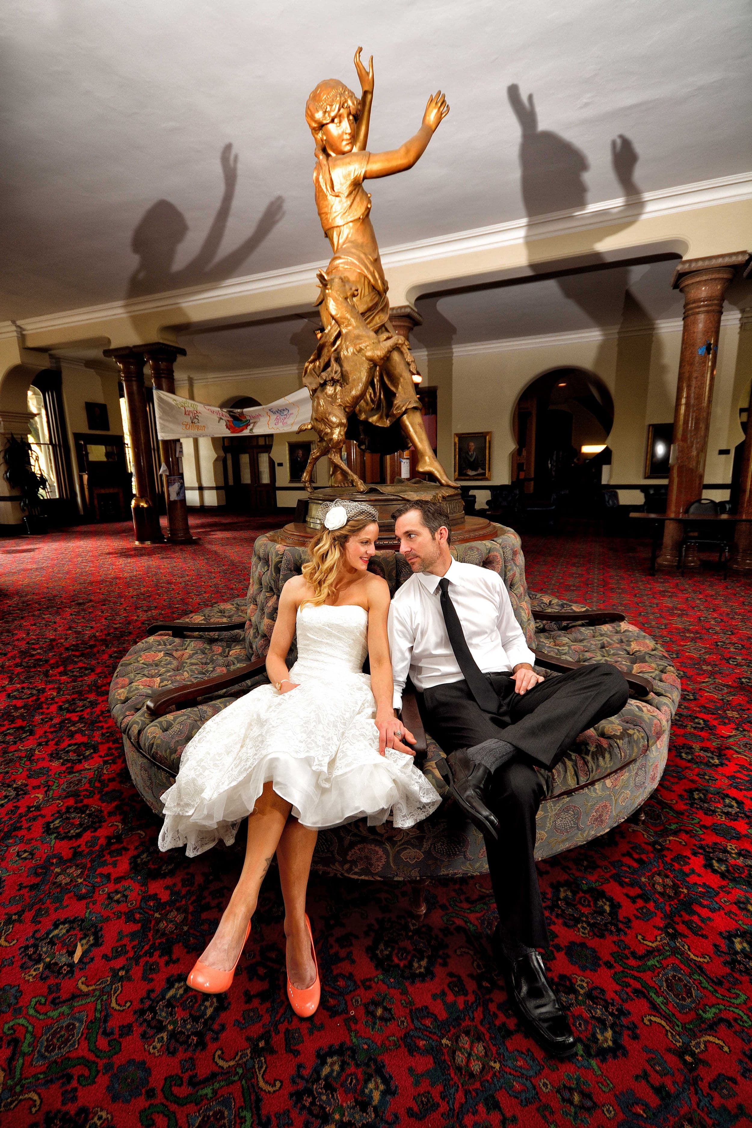 Couple seated inside Tampa Theater lobby