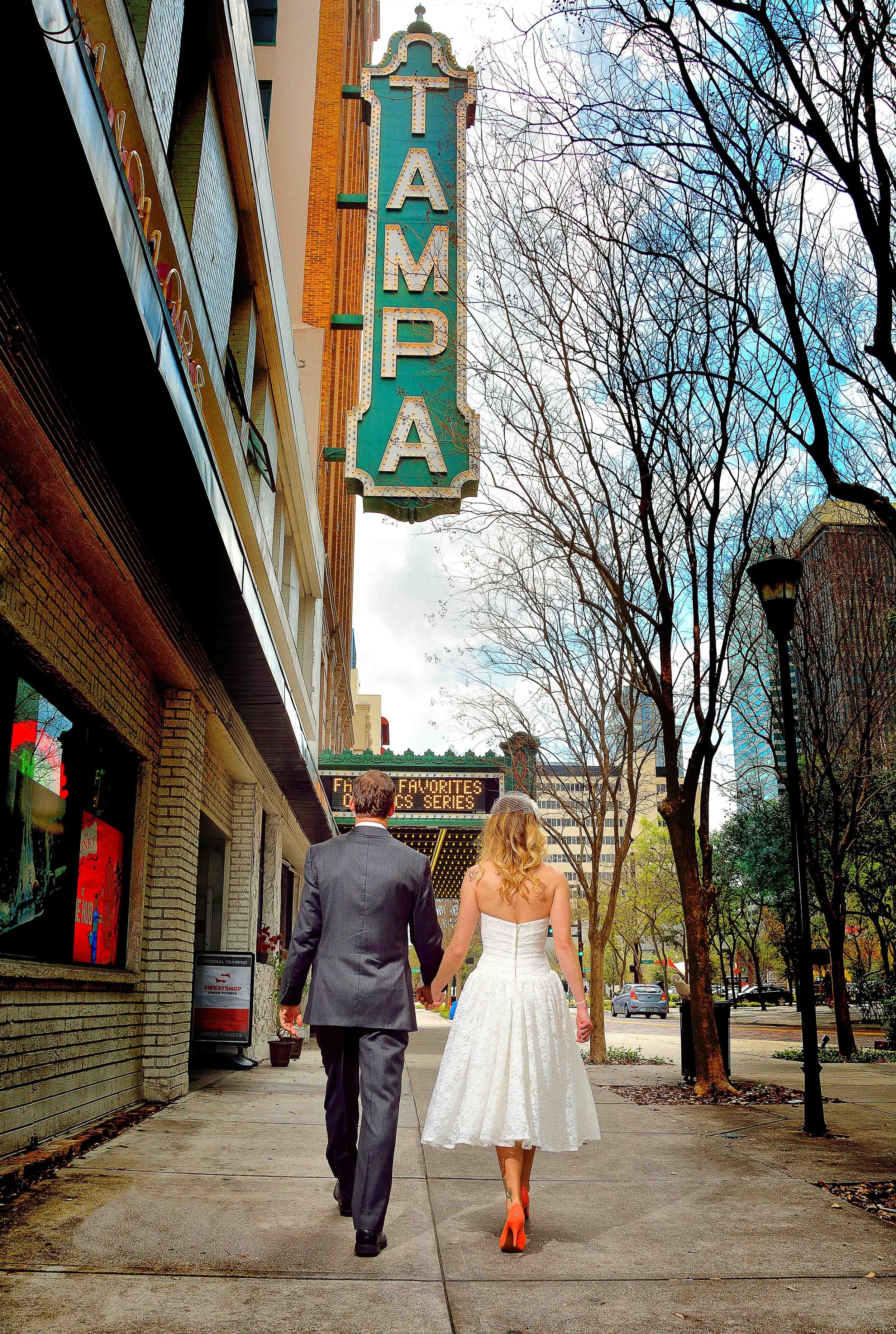 Couple under Tampa Theater sign