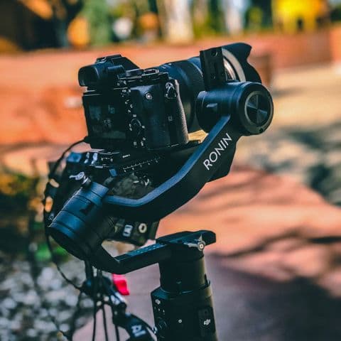 DSLR camera mounted on a gimbal stabilizer for video walkthrough filming